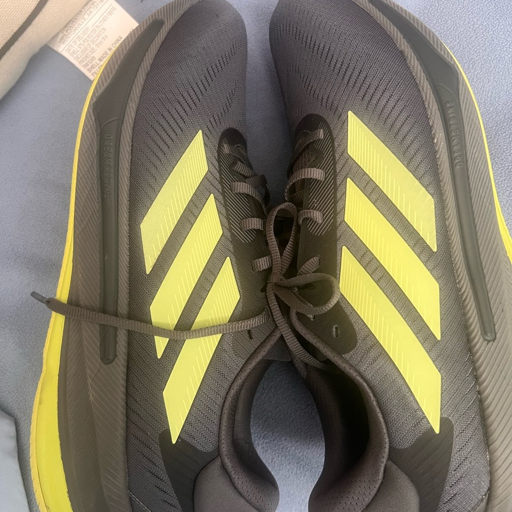 Like new Adidas Black and neon yellow Supernova
